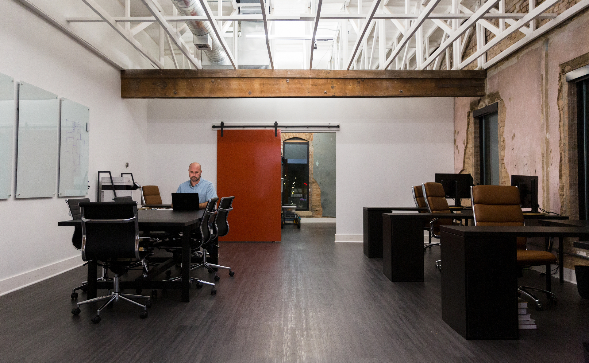 Team member working in a modern industrial-style office