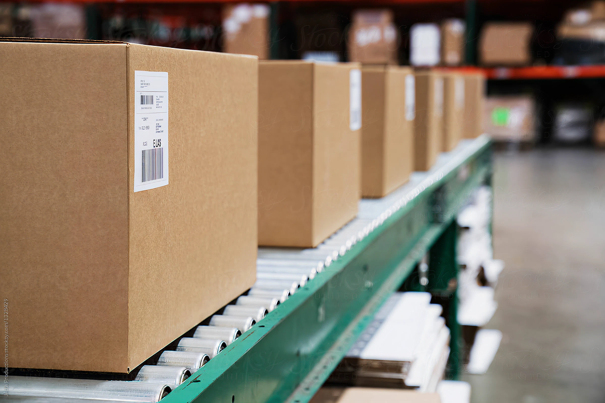 Boxes moving along a warehouse conveyor
